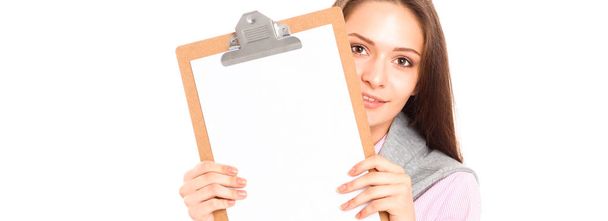 Woman showing a blank page of clipboard - Φωτογραφία, εικόνα