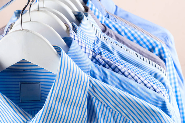 Cloth Hangers with Shirts. Mens clothes - Photo, Image