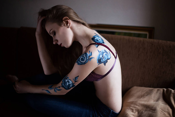 Girl in lingerie with blue roses body art painting - Foto, imagen