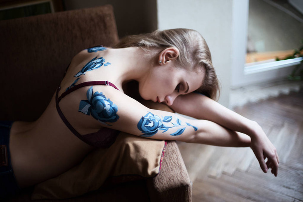 Girl in lingerie with blue roses body art painting - Foto, imagen