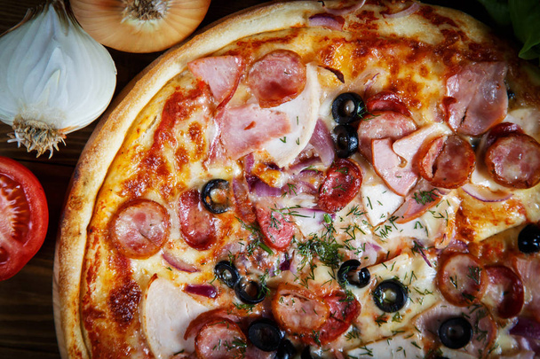 Delicious homemade pizza with mozzarella, ham, olives and fennel - Fotoğraf, Görsel