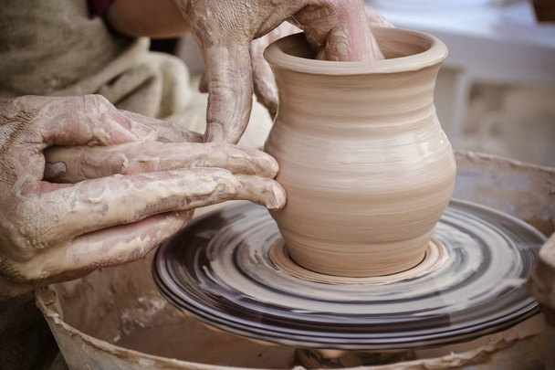 Master class on modeling of clay on a potter's wheel - Photo, image