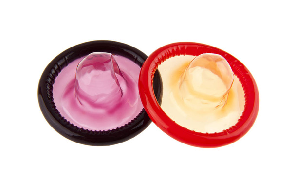 preservativos sobre fundo branco
 - Foto, Imagem
