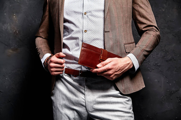handsome fashion stylish hipster businessman model dressed in elegant brown suit - Photo, Image