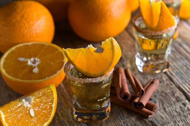 Gold tequila with orange and cinnamon . - Photo, Image