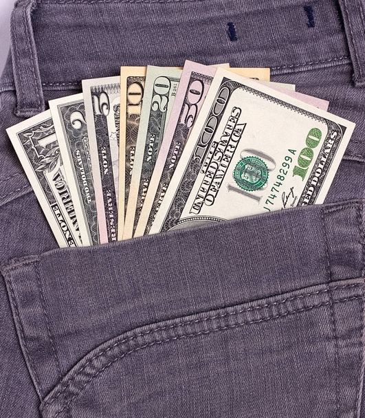 Dollarscheine in schwarzer Jeans-Gesäßtasche. - Foto, Bild