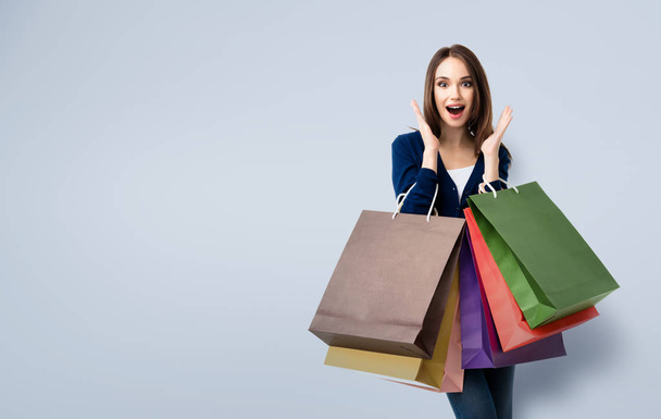 Beautiful woman in casual clothing with shopping bags - Zdjęcie, obraz