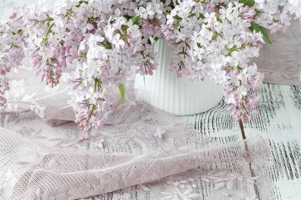 The beautiful fresh lilac violet flowers on a wooden background. - Φωτογραφία, εικόνα