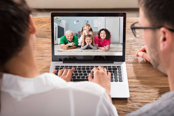 Couple Videoconferencing With Family  - Φωτογραφία, εικόνα