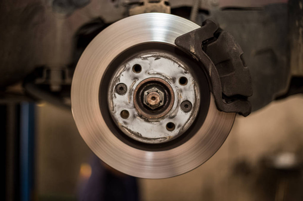 Car brake disc with no point, mechanic checks to see if everythi - Photo, Image