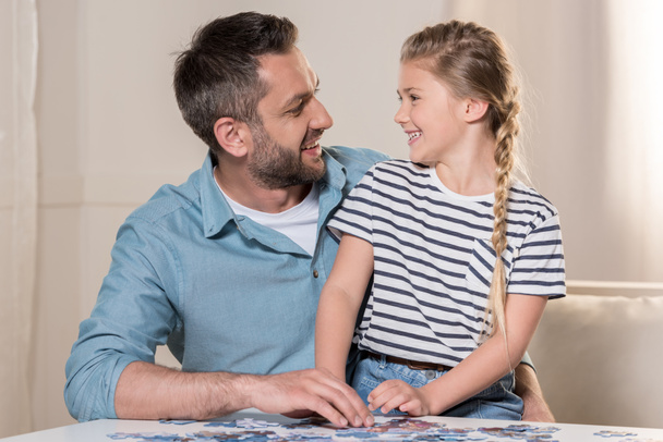 man playing puzzle with daughter - Photo, Image