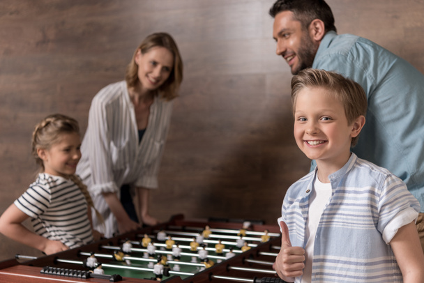 family playing foosball together - Photo, image