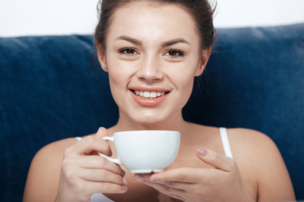 woman having coffee in bed - Фото, изображение