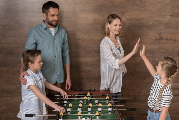family playing foosball together - Photo, Image
