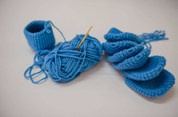Closeup blue knitting on White background  - Foto, Imagem