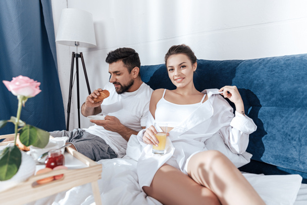 couple having breakfast in bed - Photo, image