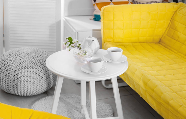 Tea set on table in modern veranda interior - Foto, immagini