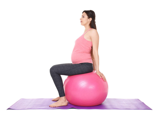 pregnant woman doing yoga - Foto, afbeelding