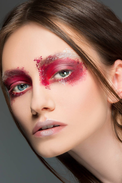 Beautiful woman face portrait close up with red make up - 写真・画像