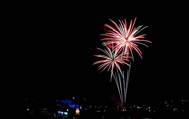 Colorful fireworks light up in black sky, - Photo, Image