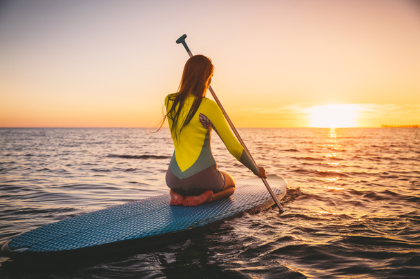 Girl stand up paddle boarding  - Photo, image