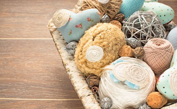 Vintage basket of needlework on wooden background - Фото, зображення