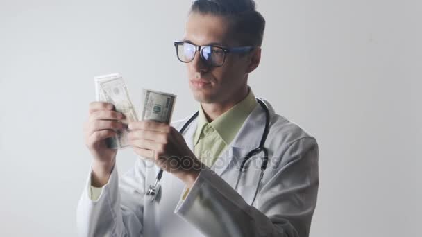 Doctor counts the money. A bribe to a medical worker. Expensive medicine. - Video, Çekim
