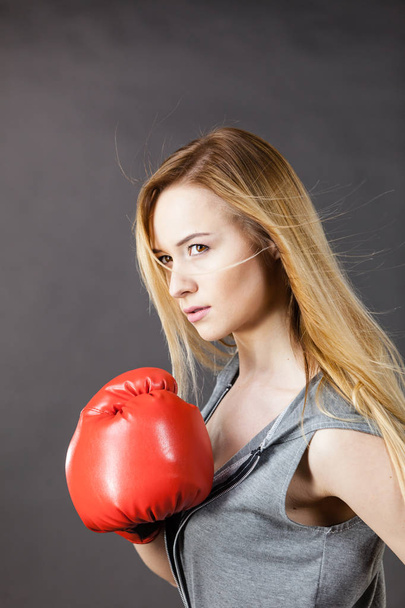 Woman wearing boxing gloves - Фото, изображение