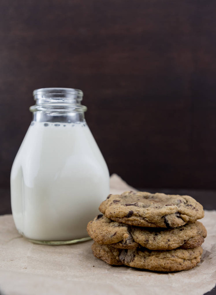Stack of Three Chocolate Chip Cookies with Milk - 写真・画像