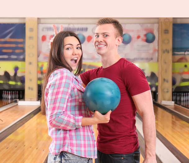 Happy couple playing bowling together - Фото, зображення
