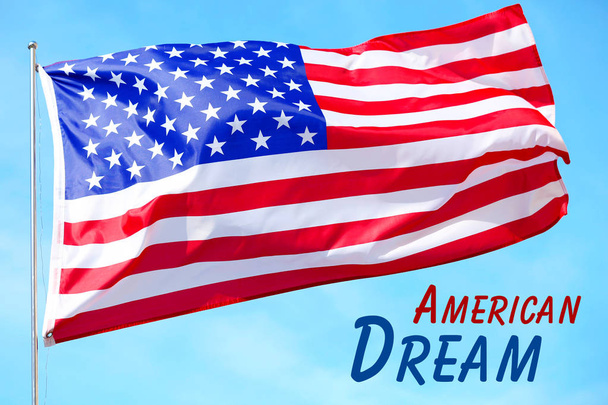 Text AMERICAN DREAM and waving USA flag on sky background - Foto, Imagen
