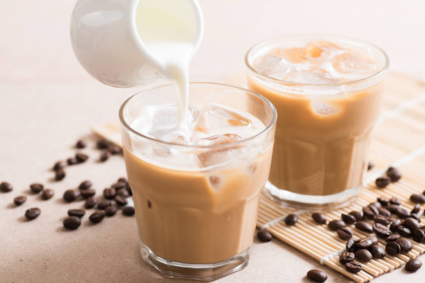 Pouring fresh milk into coffee - Valokuva, kuva