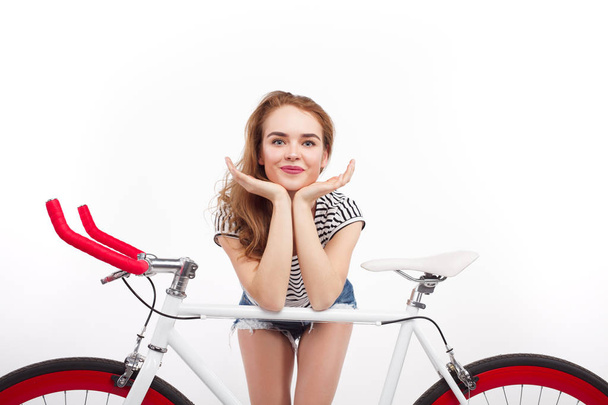 girl leaning on retro bicycle - Zdjęcie, obraz
