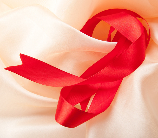 Red bow on a background fabric - Photo, image