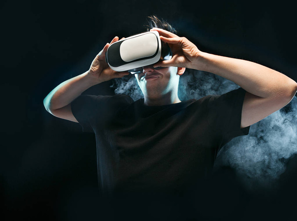 The man with glasses of virtual reality. Future technology concept. - 写真・画像