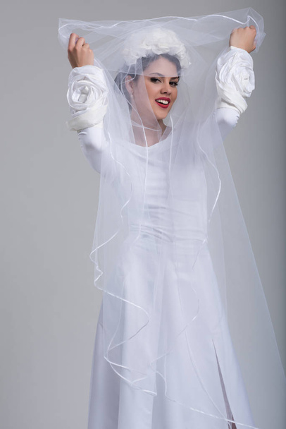 young bride in a wedding dress with a veil - Φωτογραφία, εικόνα