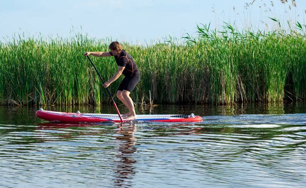 SUP stand up man with a paddle 04 - Φωτογραφία, εικόνα