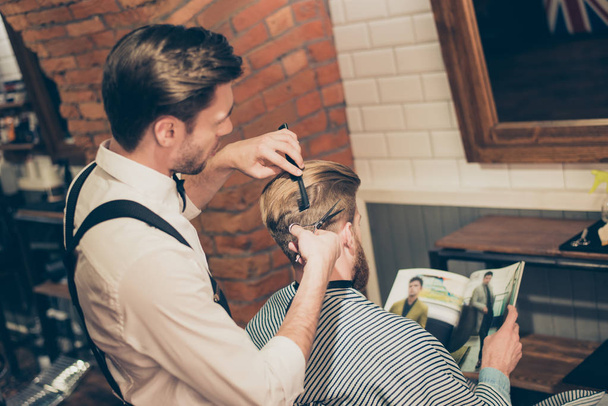 Back view of a bearded stylish barber shop client. He is getting - Fotoğraf, Görsel