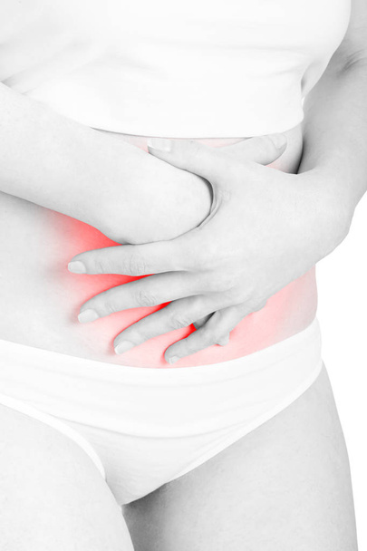Woman with stomachache or menstrual red pain area isolated - 写真・画像