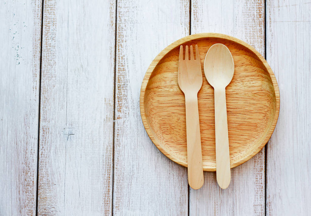 Stock Photo - set of wooden cutlery on old wooden table - 写真・画像