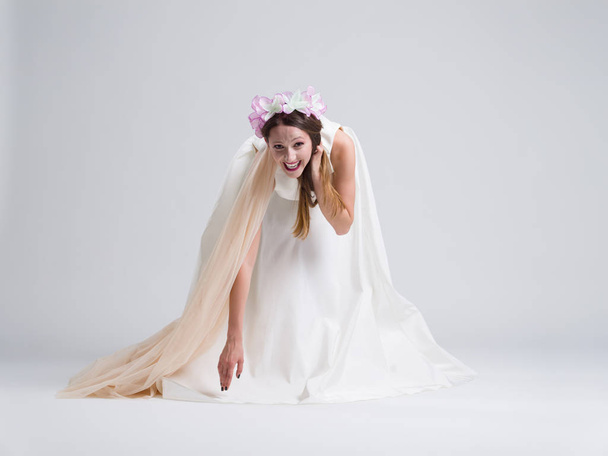 young bride in a wedding dress with a veil - Фото, изображение