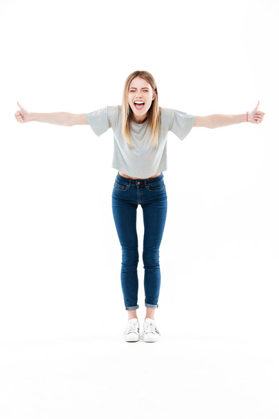 Full length portrait of a happy pretty girl screaming - Photo, image
