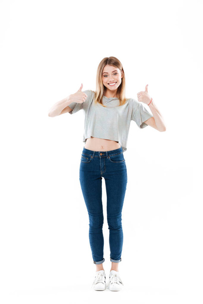 Full length portrait of a happy smiling girl standing - Photo, Image