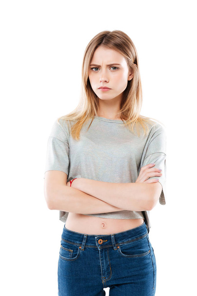 Portrait of an angry disappointed girl standing - 写真・画像