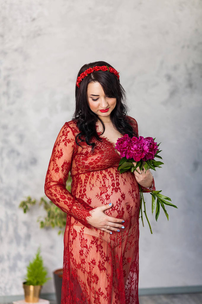 pregnant woman in red - Photo, Image