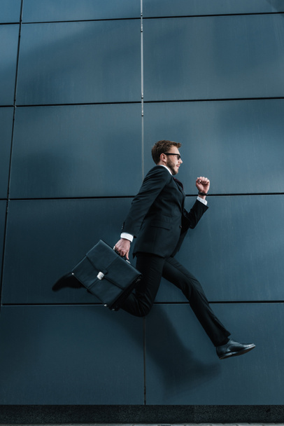 Stylish businessman with briefcase  - Fotografie, Obrázek