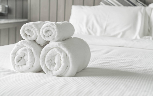 White towel on bed decoration in bedroom interior  - Фото, зображення