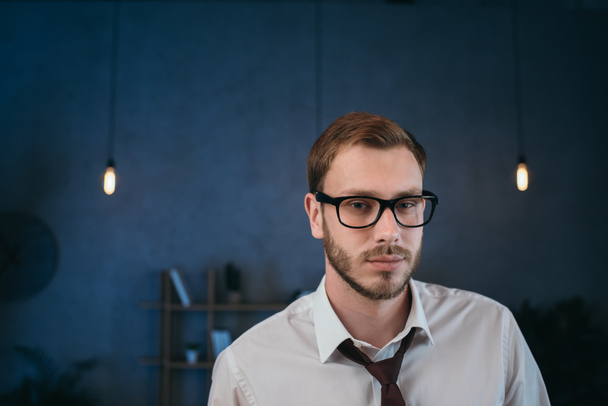 businessman in glasses looking at camera at office - Photo, Image