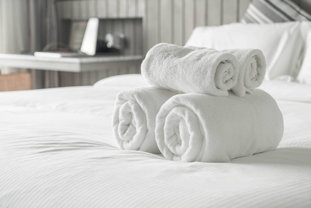White towel on bed decoration in bedroom interior  - Fotografie, Obrázek