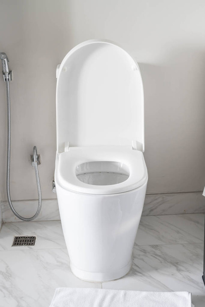 Toilet seat decoration in bathroom interior - Фото, изображение